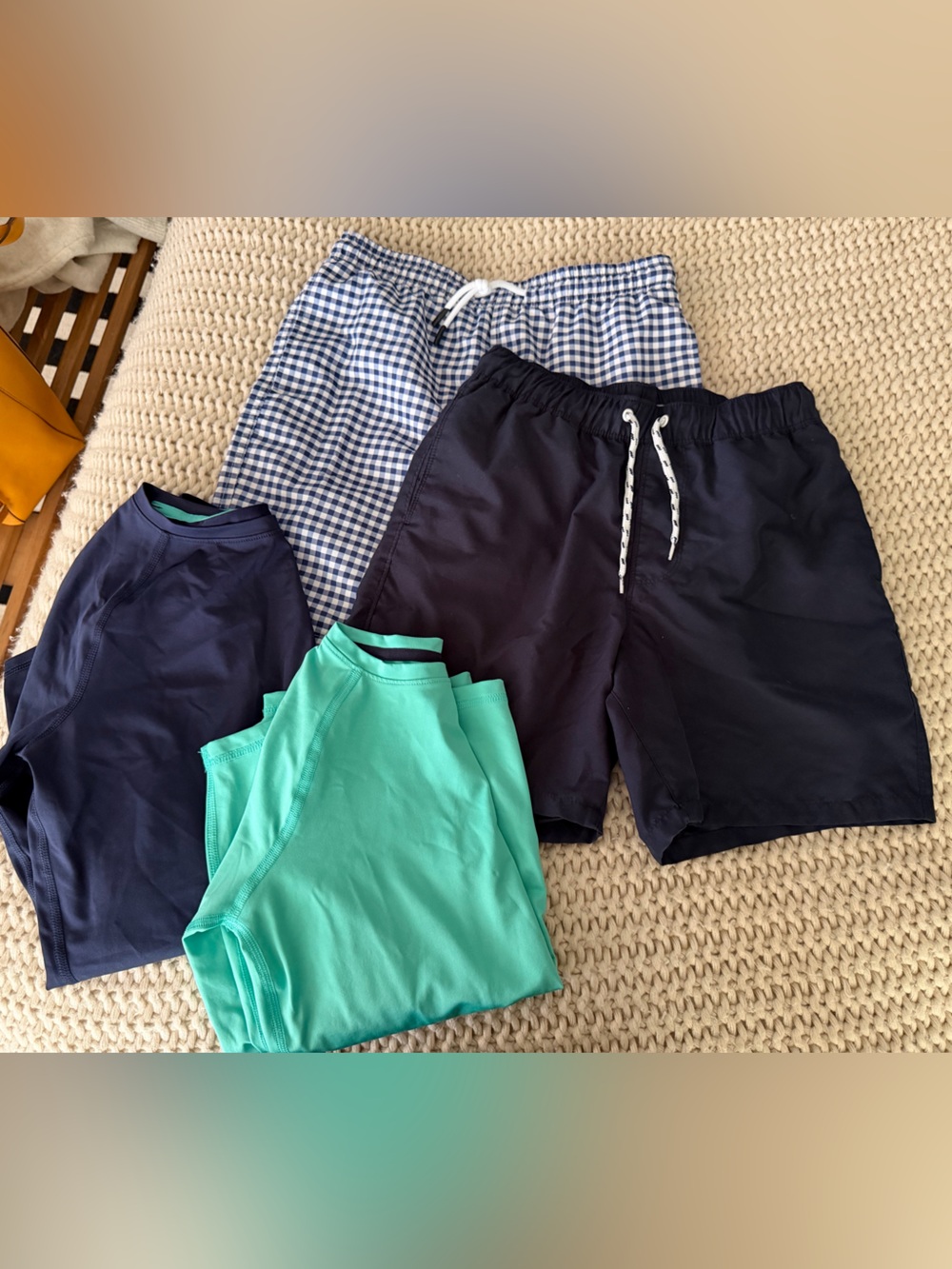 Two swimsuits and two rashguards